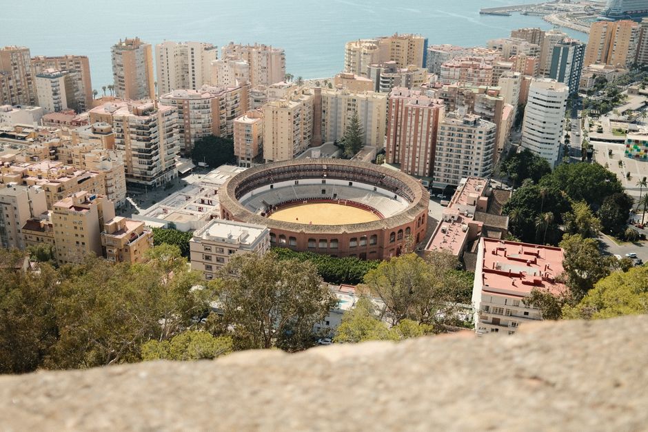 Scenic aerial view of Plaza de Toros and surrounding cityscape in Malaga, Spain.