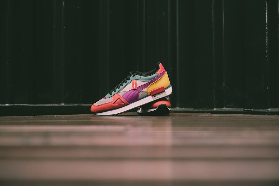 Vibrant sneaker in bold colors on a wooden floor background.